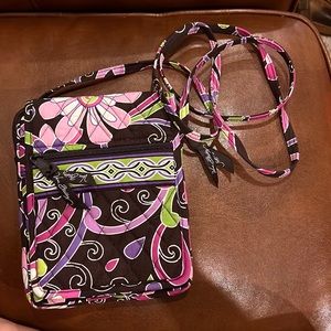 Very Bradley crossbody. Brown background. Pink and purple multicolored pattern.